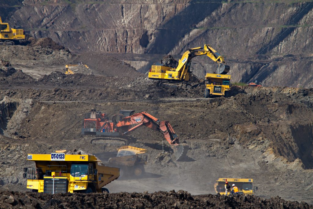Construction vehicles in mining field