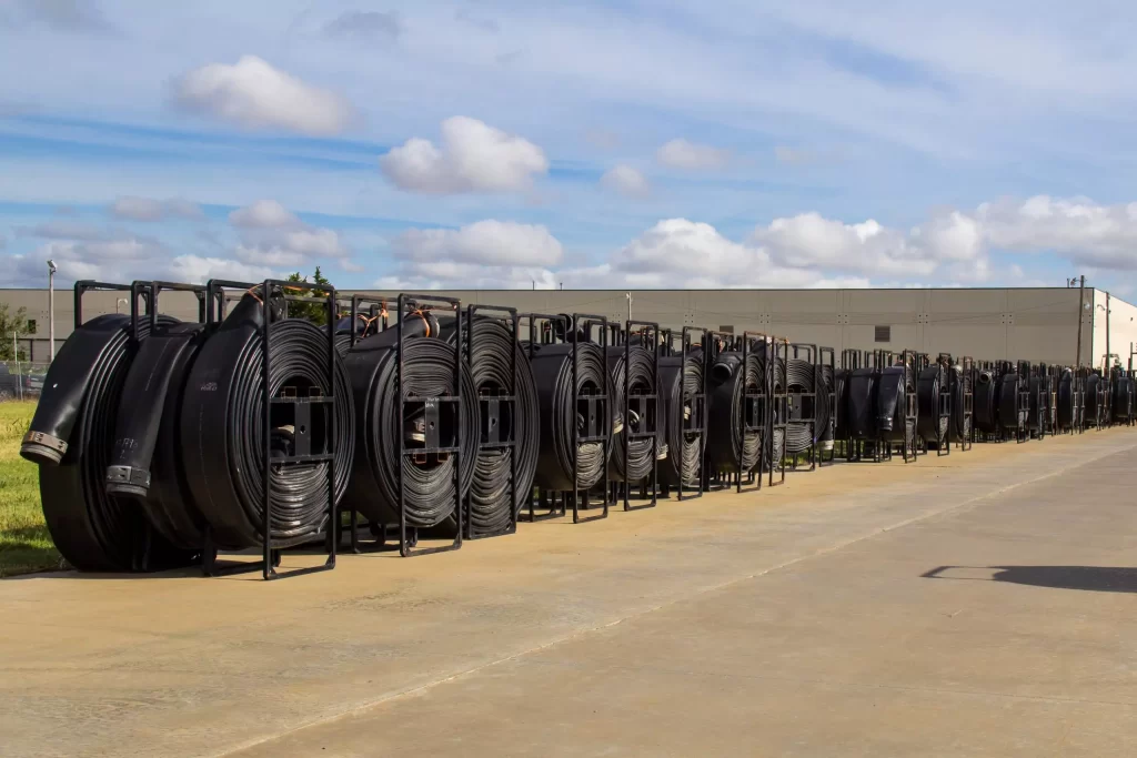 Rows of black layflat rental reels at factory - 2560x1707